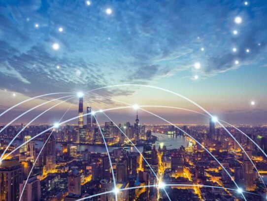 The city of Shanghai at night with a network of lights